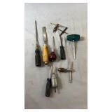 Collection of workshop hand tools including