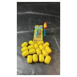 Collection of yellow Kinder Egg toy capsules, all