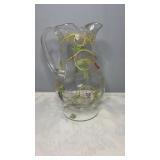 Clear footed glass pitcher with hand-painted