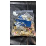 Collection of various lapel and souvenir pins,