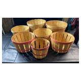 Collection of seven wooden slat bushel-style