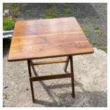 Folding table with a rectangular wood-look top