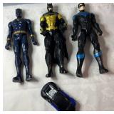 Three large superhero action figures featuring