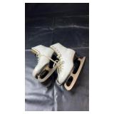 Pair of white lace-up figure skates, size 7, with