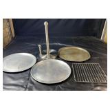 Kitchen group with two perforated pizza pans, an