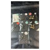 Seven pairs of nautical-themed dangle earrings