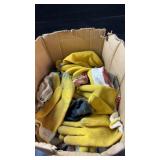 Box of work gloves in various styles, including
