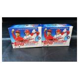Two boxes of Topps Baseball 2022 Series 1 cards.