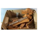 Box of plastic toy construction pieces featuring
