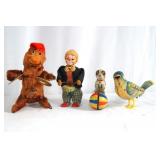 Four wind up vintage post war toys