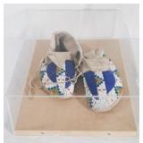 Beaded moccasins in presentation
