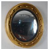 Regency Style gilded and ebonized convex mirror