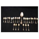 Sterling tea spoons plus large spoon