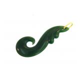 A deep green carved jade pendant