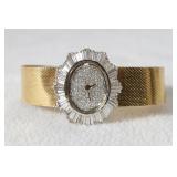 14kt Gucci ladies watch w 4 ct diamond bezel