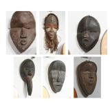 Collection of six African Dan wood passport masks.