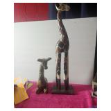 Pair Of Giraffes One Tall One Sitting Down