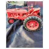 Metal Farmall Tractor Needs Cleaned