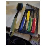 Four knives & a table serving spoon