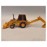 Case 580E Backhoe -Ertl - Plastic Chassis - 21”x7”