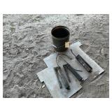 THREE GREASE GUNS IN A METAL BUCKET AND PLATE
