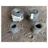 2 SMALL ROLLS & 2 LARGE ROLLS OF BARBED WIRE
