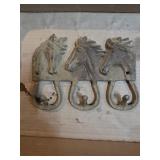 Cast iron horse coat,apron, and chaps hanger