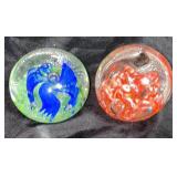 Two unsigned paper weights