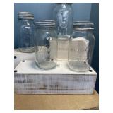Four vintage guart canning jars.