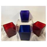 4 cubed Tele floral containers, one purple one