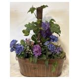 Planter with artificial flowers