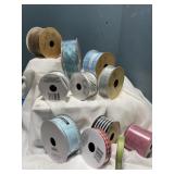 11 rolls of ribbon assorted sizes & colors