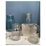 One vintage aqua blue court jar, three vintage