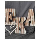Corrugated metal letters and metal horse heart.