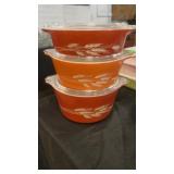 Three Pyrex bowls with wheat pattern and glass