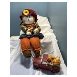 Scarecrow and pick up truck.