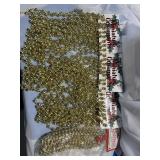 4 strings of gold garland .