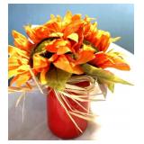 New orange sunflowers in a red jar