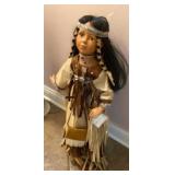 Native American doll stands about 24 inches tall