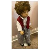 Little boy doll stands about 24 inches tall