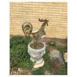 large cement planter and rooster