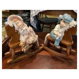 Young boy and girl on rocking horses
