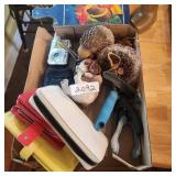 box of dog grooming, wallet and more