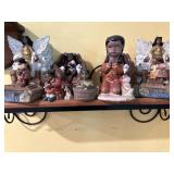 Wall shelf with figurines