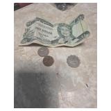 1 banknote and 3 coins from central bank of the