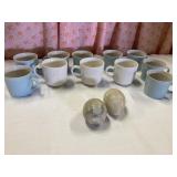 11 mugs and two stone eggs