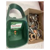 Scotts spreader and a box of hardware