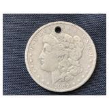 1902 silver Morgan dollar with hole in it