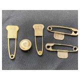 Small pin and 4 laundry tags