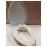 Pallet return lifted toilet seat